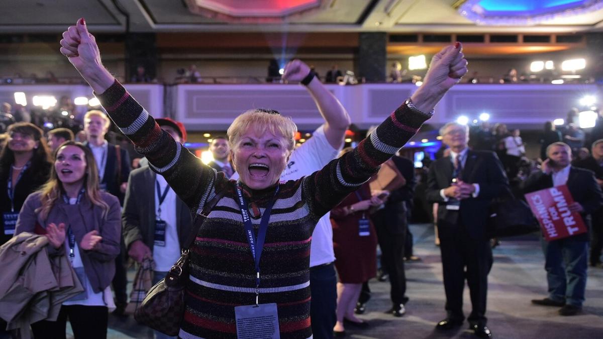 A Donald Trump voter watches election results come in